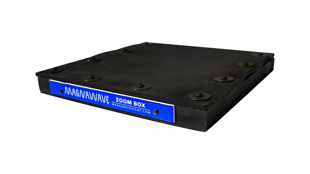 MagnaWave Zoom Box—a black, flat accessory pad with mounting buttons and branded blue edge label—designed to complement PEMF device setups.